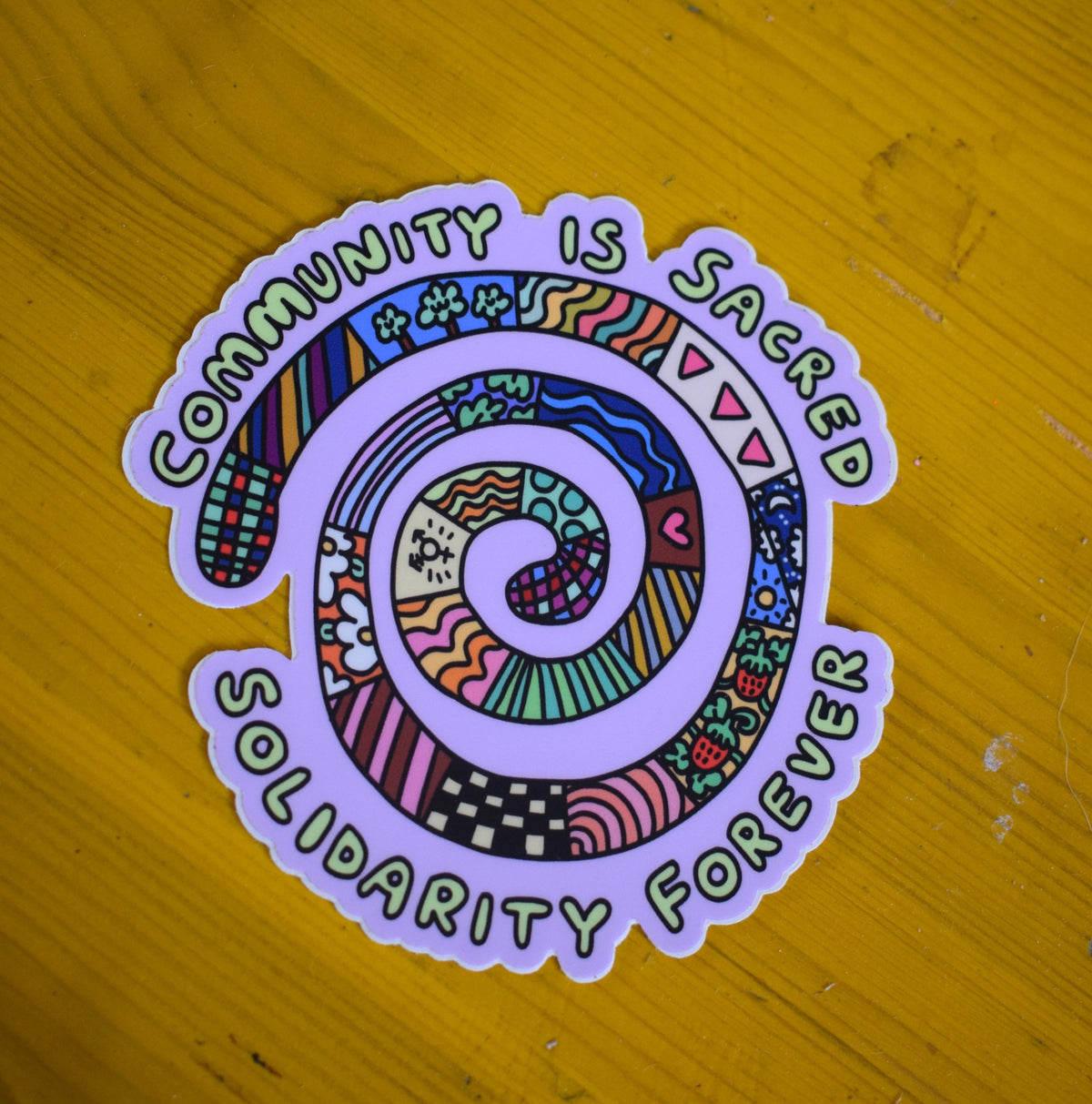 I'M A RARE FIND - "Community is sacred, solidarity forever" large sticker (10.2cm x 9.8cm)